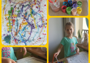 dziewczynka na soli rozsypanej na tacy robi plamy i wzory kolorowymi farbami nabieranymi pipetą