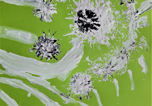 prac plastyczna: na jasno zielonej kartce biało czarne dmuchawce