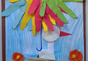 bocian siedzi na gnieździe wśród kwiatów a nad im parasol z ludzkich dłoni - praca kredką i kolorowy papier