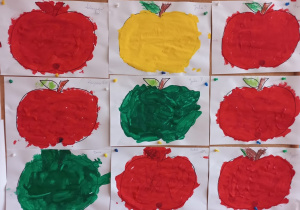 prace plastyczne - kontury jabłek pomalowane farbą plakatową na kolory; żółty, czerwony, zielony